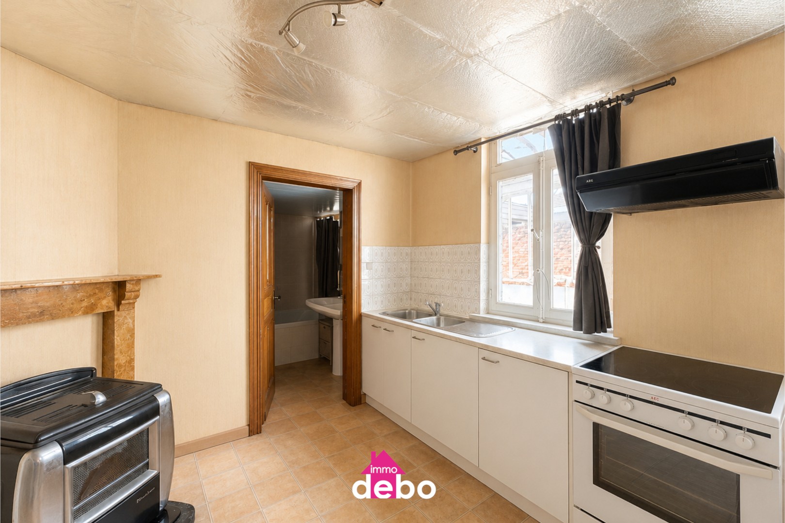 Gezinswoning met garage, 2 slaapkamers, zolder en tuin op wandelafstand van het centrum