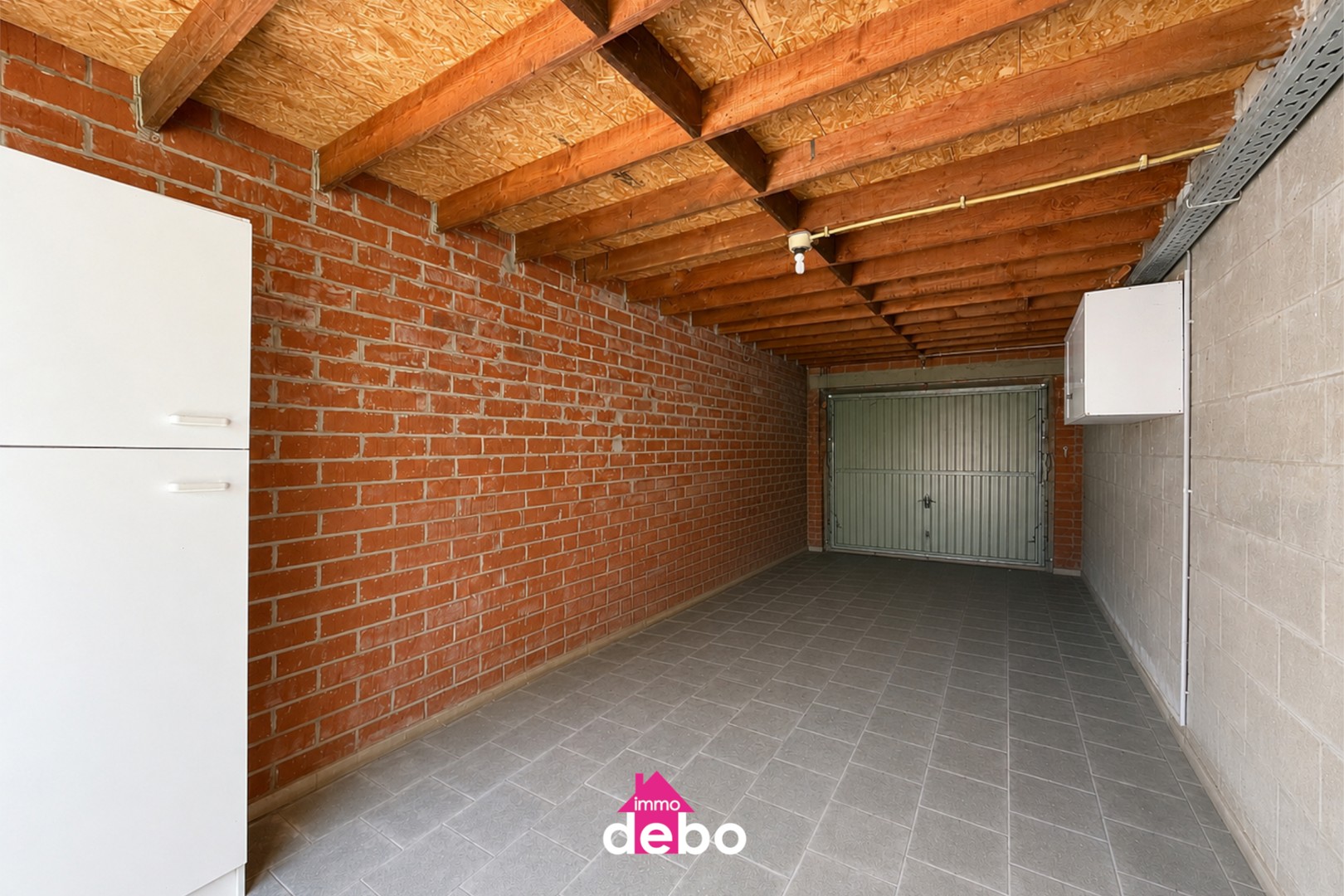 Gezinswoning met garage, 2 slaapkamers, zolder en tuin op wandelafstand van het centrum